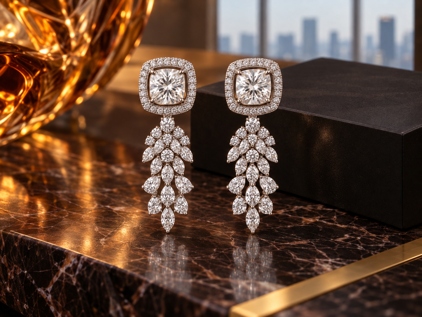 White diamond cascade earrings against dark marble and warm amber